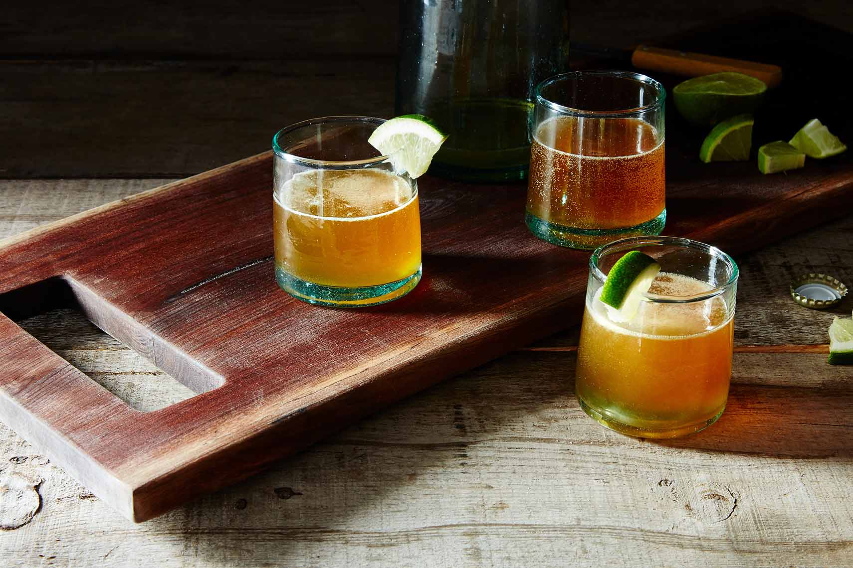 beer and mezcal cocktail with lime agave and dashes of hot sauce and worcestershire